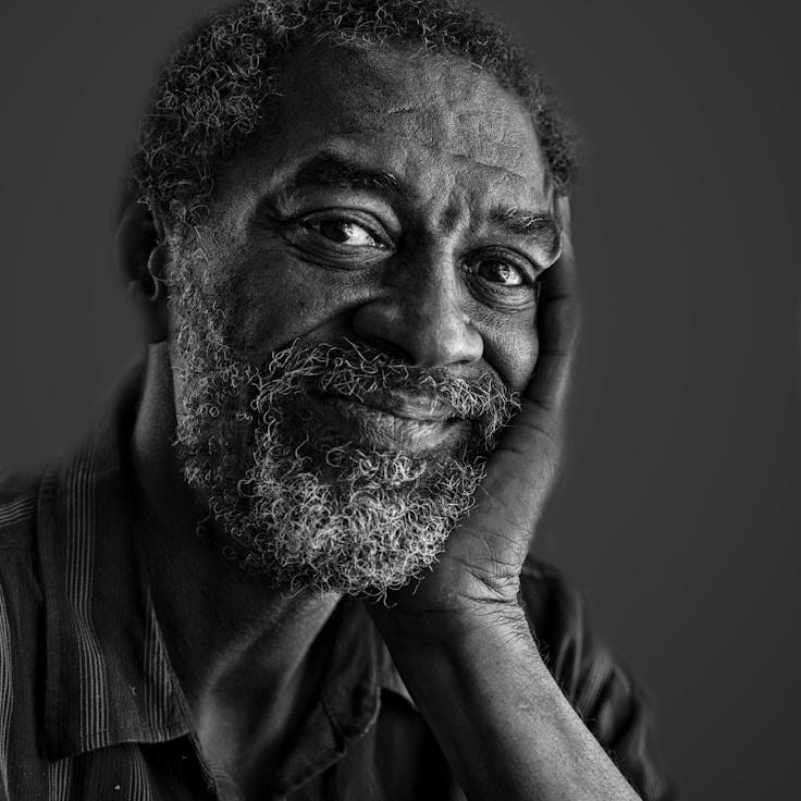 Alex Carter, Lead Design Curator at CrownBeaconTrail, reviewing corporate floral arrangements